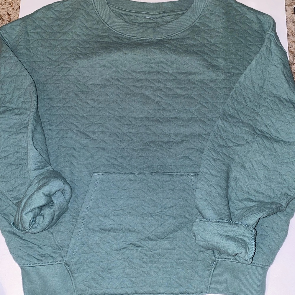 Green sweater. Size Small.